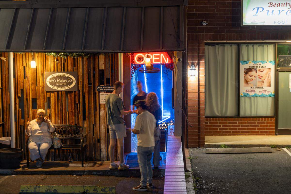 Customers wait to enter Jeff’s Bucket Shop on Montford Drive.