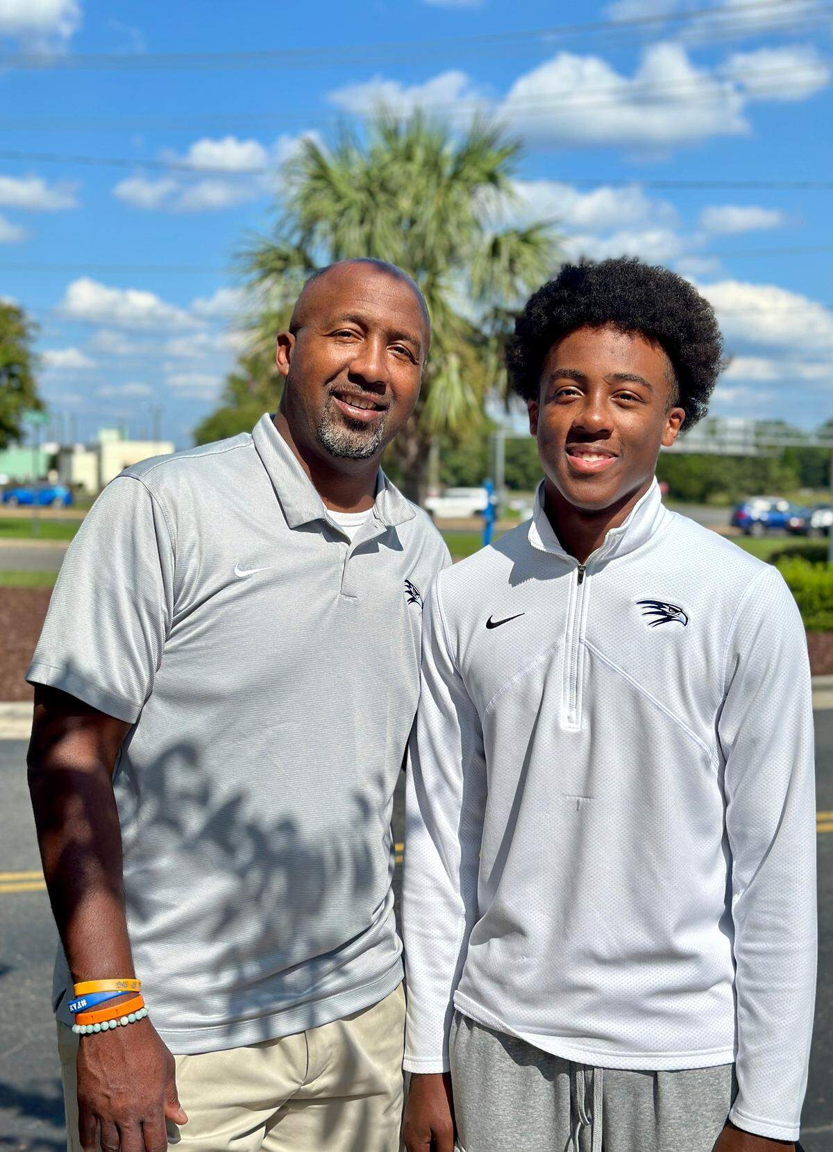 Titus Ivory II (left) was a star at North Mecklenburg High. His son, Titus III, has helped Charlotte Latin to a 7-0 start
