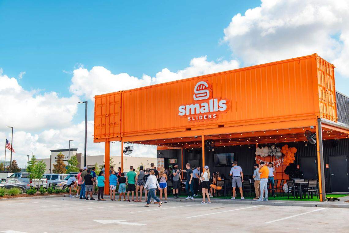 Smalls Sliders operates from orange and black 750-square-foot shipping containers, or “cans” with drive-thru and a walk-up window.