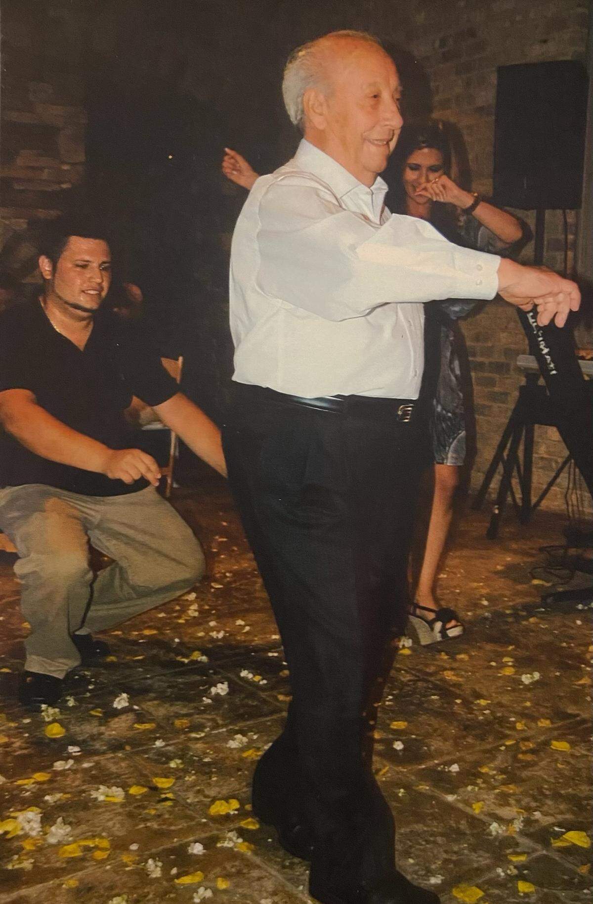 Philip Katopodis dances at his 50th wedding anniversary party. His daughter, Jerri Holevas, displays this photo of him on her refrigerator.