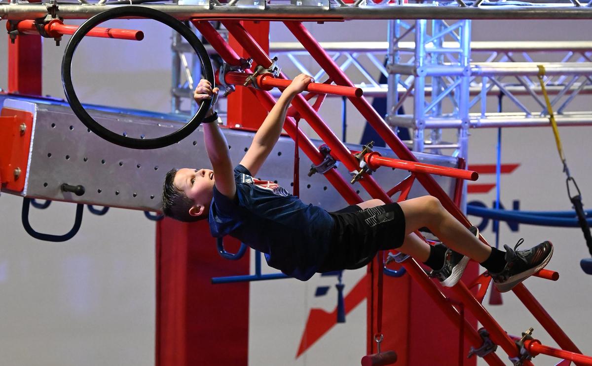 Ryan Hellman, 10 yrs., works his way through a competition course at Ninja Nation in Huntersville, NC on Wednesday, February 8, 2023.