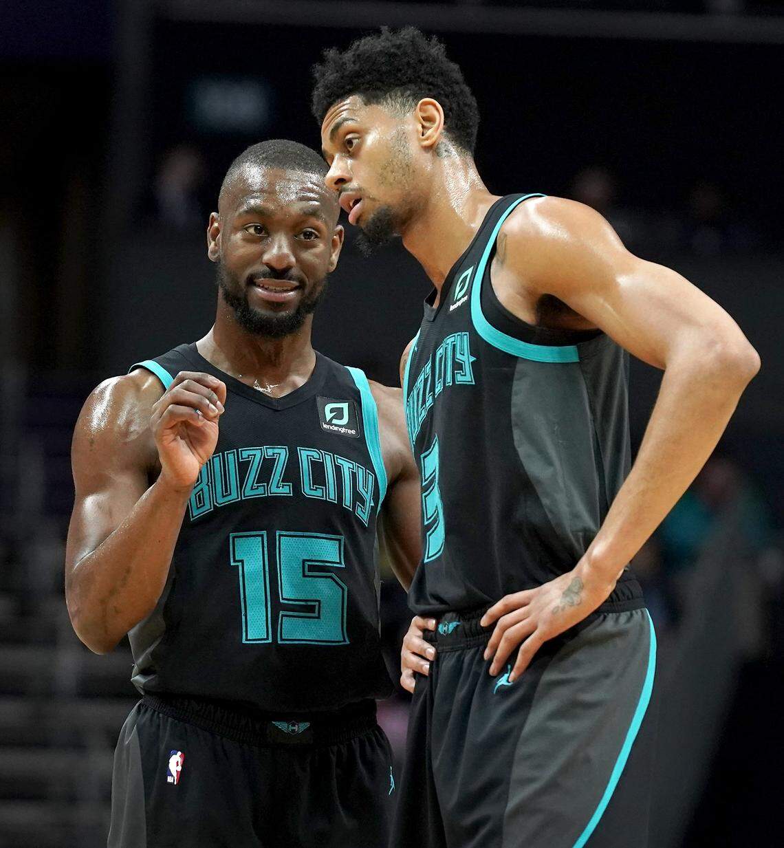 Kemba Walker, left, and Jeremy Lamb are set to become unrestricted free agents this summer. The Hornets would leap into luxury-tax territory if the team re-signs both players.