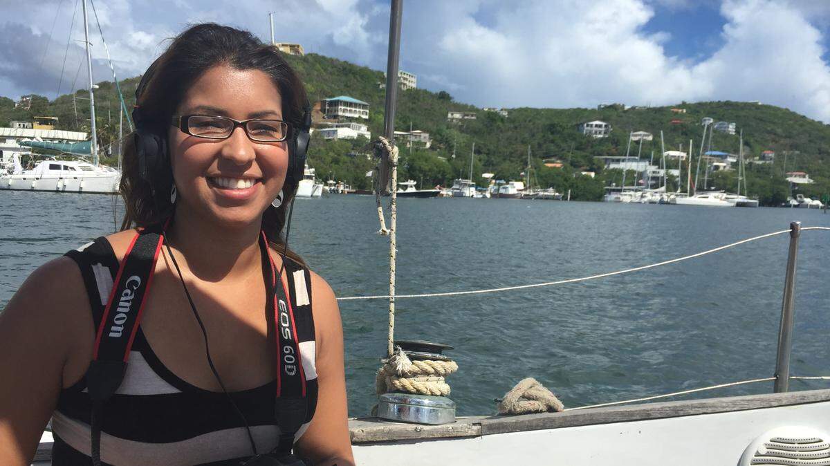 After quitting her job as a reporter, Sarah Colón-Harris — pictured here in St. Thomas — traveled, documenting her journey and the interesting people she met along the way.