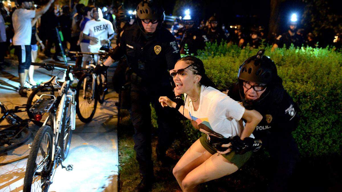 CMPD officers arrest a protester along E. Trade Street in Charlotte, NC on Saturday, May 30, 2020. The protesters are demonstrating against police brutality after the death of George Floyd in Minneapolis, MN, on Monday, May 25, 2020.