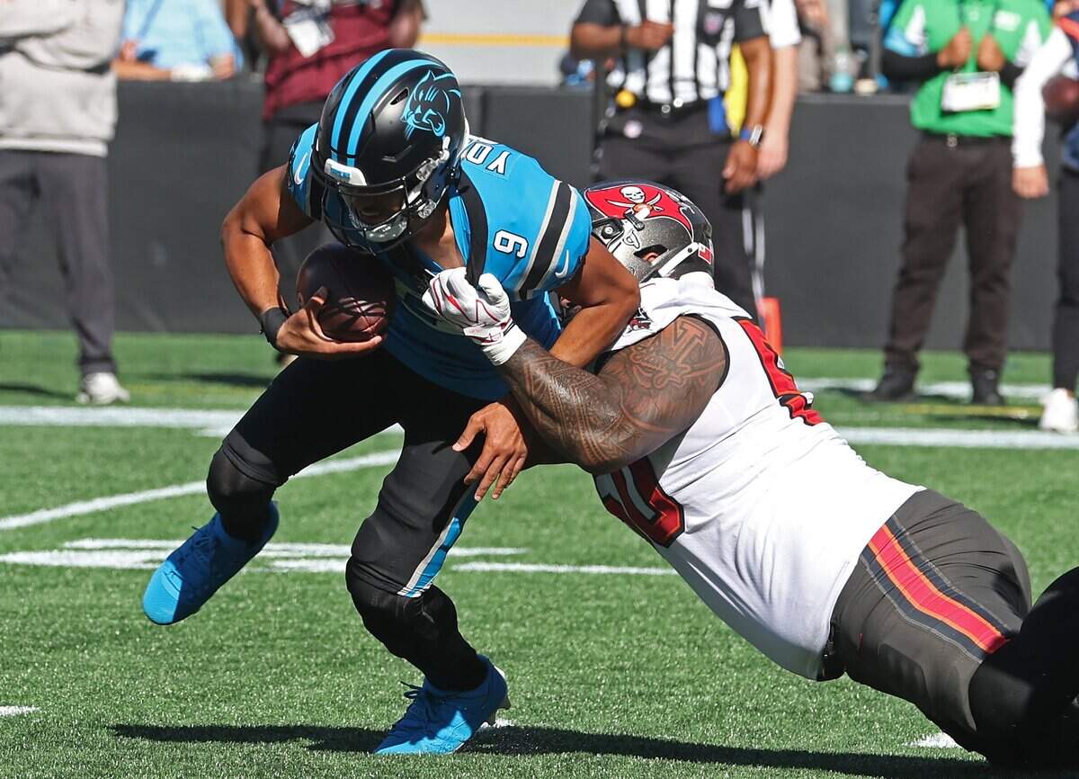 Carolina Panthers quarterback Bryce Young, left, is sacked by Tampa Bay Buccaneers Vita Vea, right, during action at Bank of America Stadium in Charlotte, NC on Sunday, October 25, 2026.