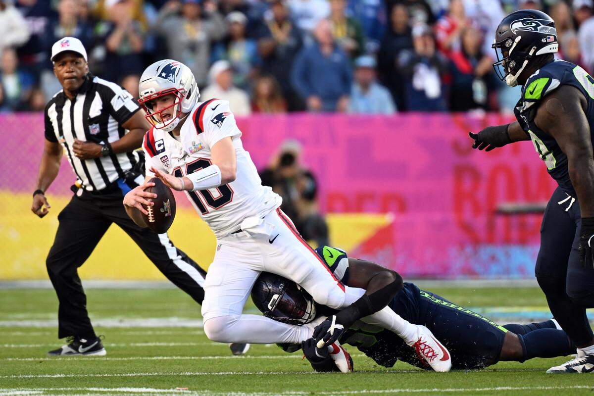 New England Patriots quarterback Drake Maye is tackled by Seattle Seahawks linebacker Derick Hall during Super Bowl LX between the New England Patriots and the Seattle Seahawks on Feb. 8, 2025, at Levi’s Stadium in Santa Clara, California.