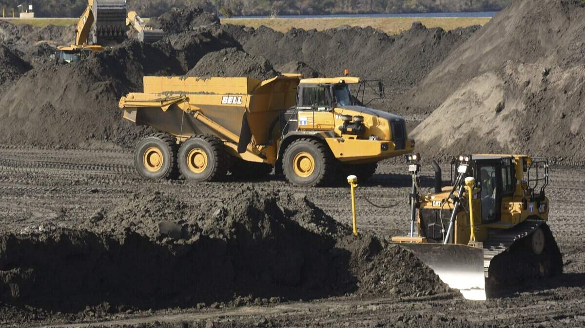 Duke Energy crews remove coal ash from ponds at the Sutton power plant in Wilmington in 2017. (AP Photo)