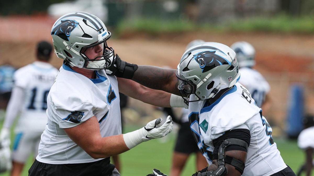 Panthers offensive linemen Jarrett Kingston, left, and Damien Lewis run through a drill during the first day of minicamp in Charlotte, NC on Tuesday, June 10, 2025.