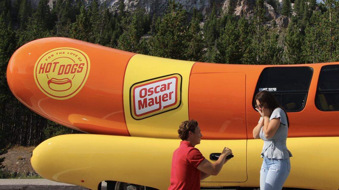 Charlotte-area man pops the question beside his work vehicle. Nation says, ‘Hot dog!’
