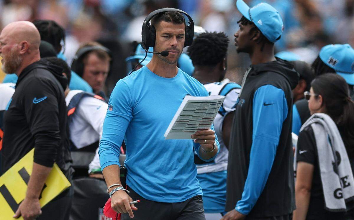 Panthers head coach Dave Canales walks along the sidelines during Sunday’s game against the Chargers at Bank of America Stadium.