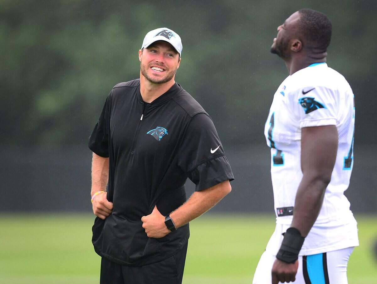 Carolina Panthers special teams coach Chase Blackburn (left) talks with defensive end Efe Obada (right) before a practice at Wofford College in Spartanburg, SC during training camp 2018. Blackburn was promoted to the coordinator position in January, and is trying to re-shape the way the Panthers measure special teams.