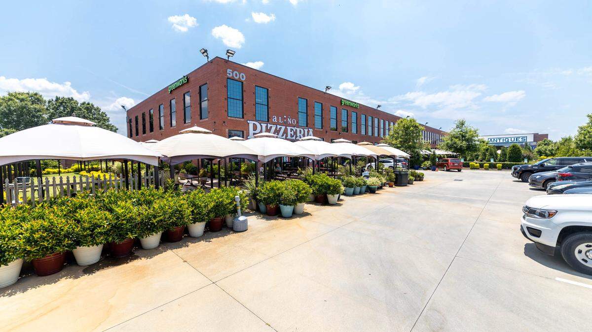 Once set to be razed, Merino Mill is now a vibrant community space surrounded by greenery.