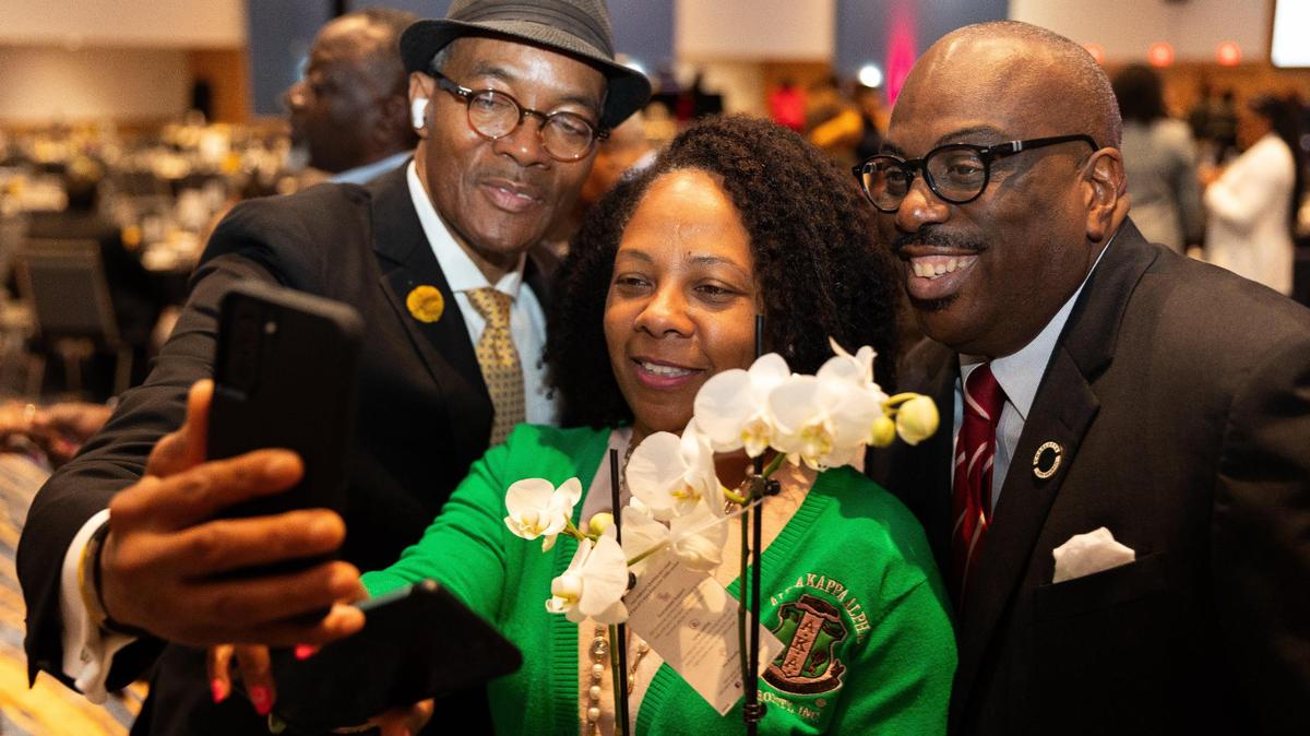 Park Church’s Reginald Powe takes a selfie with Alpha Kappa Alpha Sorority Incorporated’s Sabrina Taylor and Charlotte City Council member Malcolm Graham following the 30th Annual McCrorey YMCA MLK Holiday Breakfast at the Charlotte Convention Center in Charlotte.