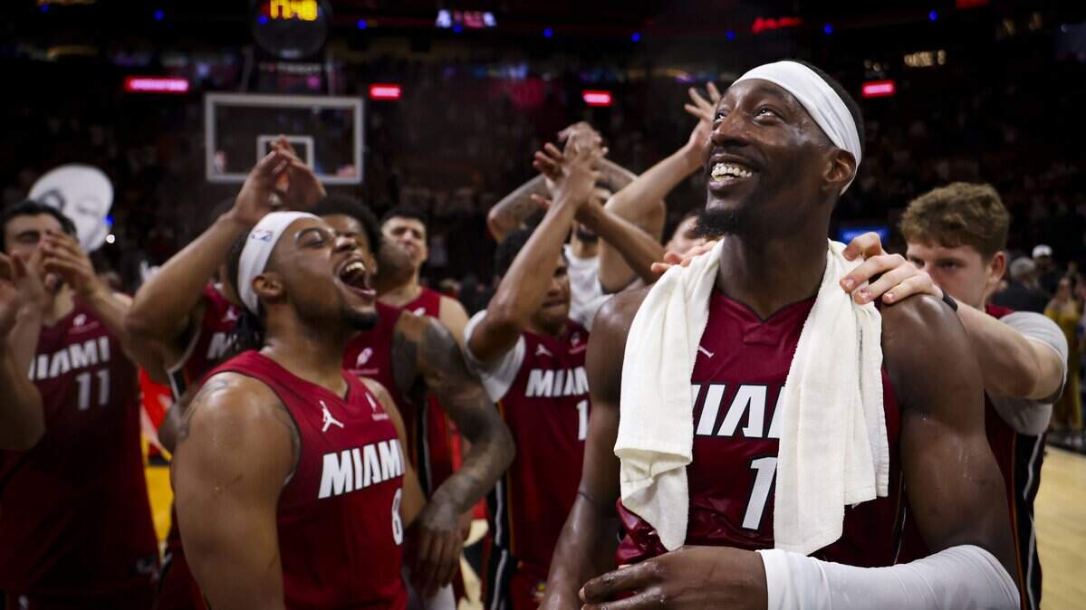 Miami Heat center Bam Adebayo (13) celebrates with teammates after scoring 83 points against the Washington Wizards, the second-highest single-game total in NBA history, Tuesday, March 10, 2026, at Kaseya Center in Miami. The Heat won 150-129.