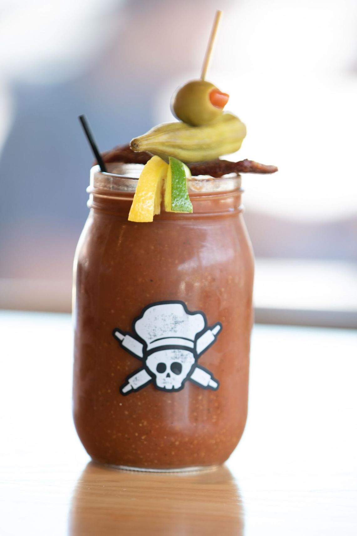 The Vicious Biscuit menu includes craft cocktails like the Bloody Mary, with house-made spicy mix, Tito’s vodka garnished with pickled okra, olives, lemon slice, lime slice and hick-cut bacon.