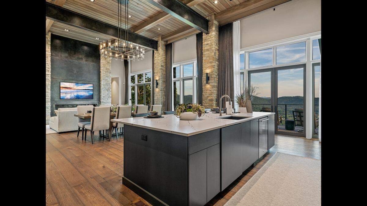 The kitchen and dining area of the home looks out to endless North Carolina mountains.