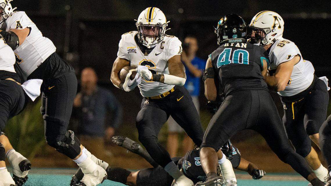 Appalachian State running back Camerun Peoples (6) runs the ball against Coastal Carolina. David Yeazell-USA TODAY Sports