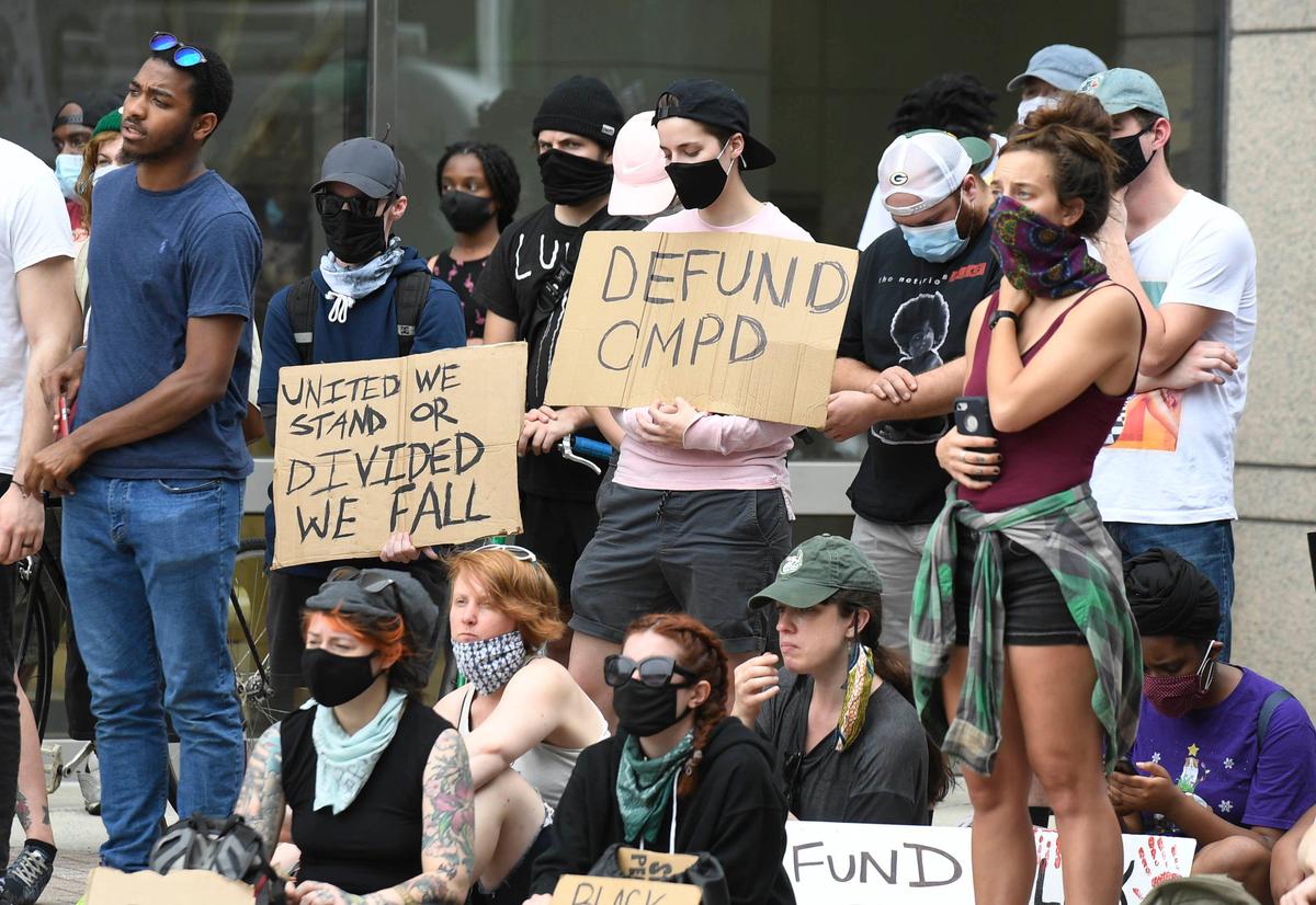 The crowd listens to a speaker at the Charlotte-Mecklenburg Government Center on Monday, June 8, 2020 as part of a gathering sponsored by Charlotte Uprising.