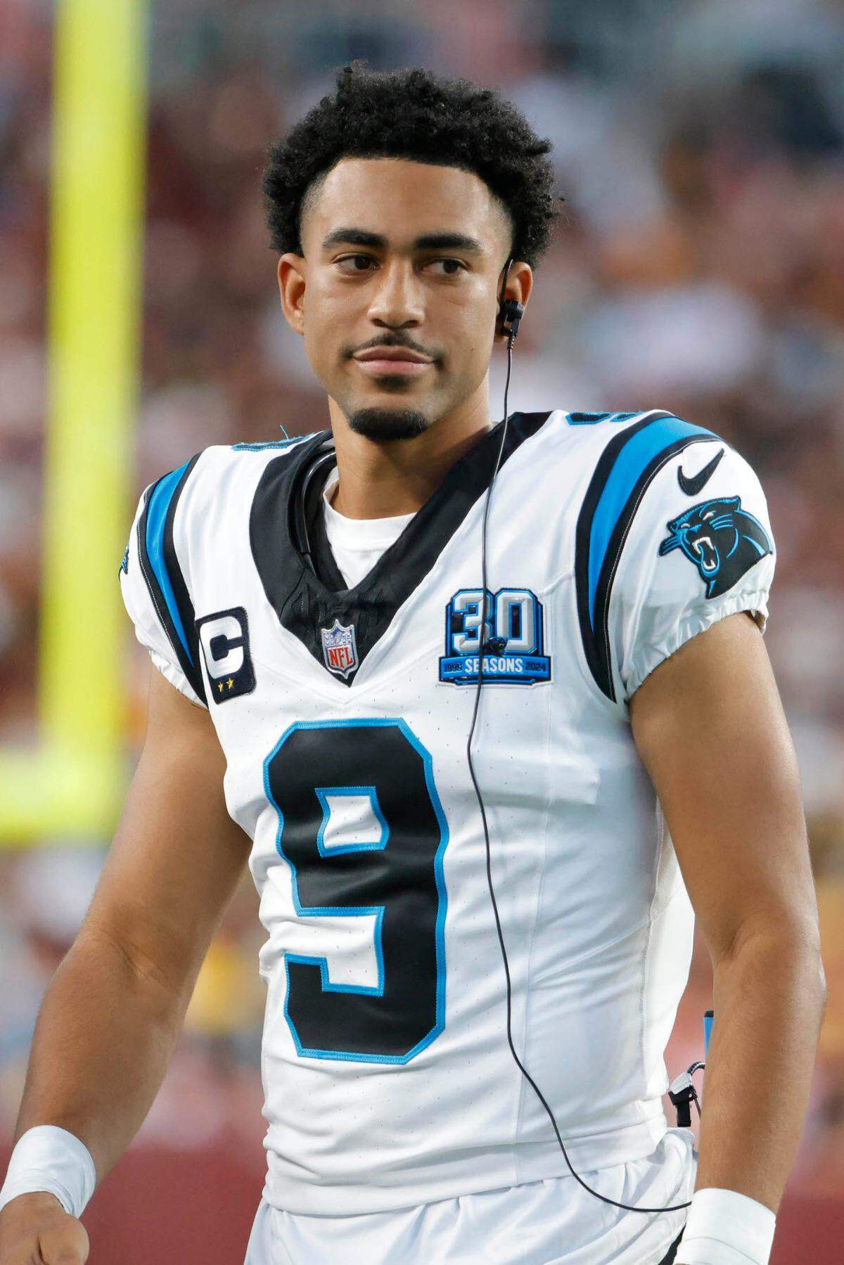 Carolina Panthers quarterback Bryce Young (9) looks on from the sidelines during the second half against the Washington Commanders at Northwest Stadium on Oct 20, 202