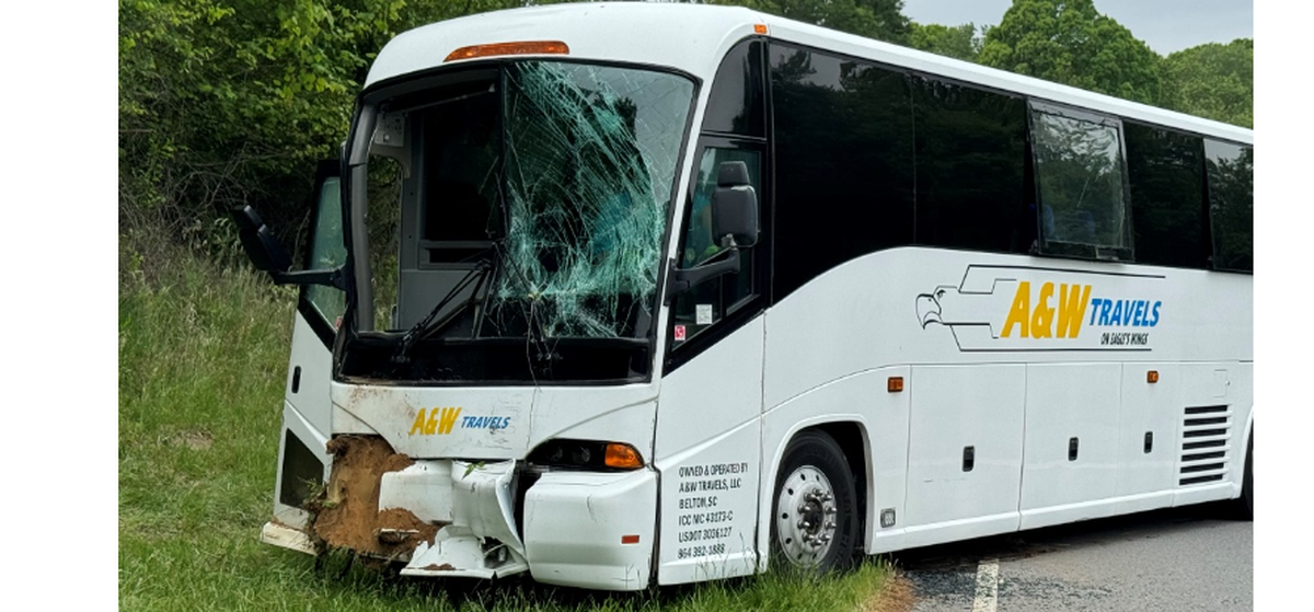 The driver of this bus that rear-ended the other bus on I-85 was cited for failure to reduce speed, police said.