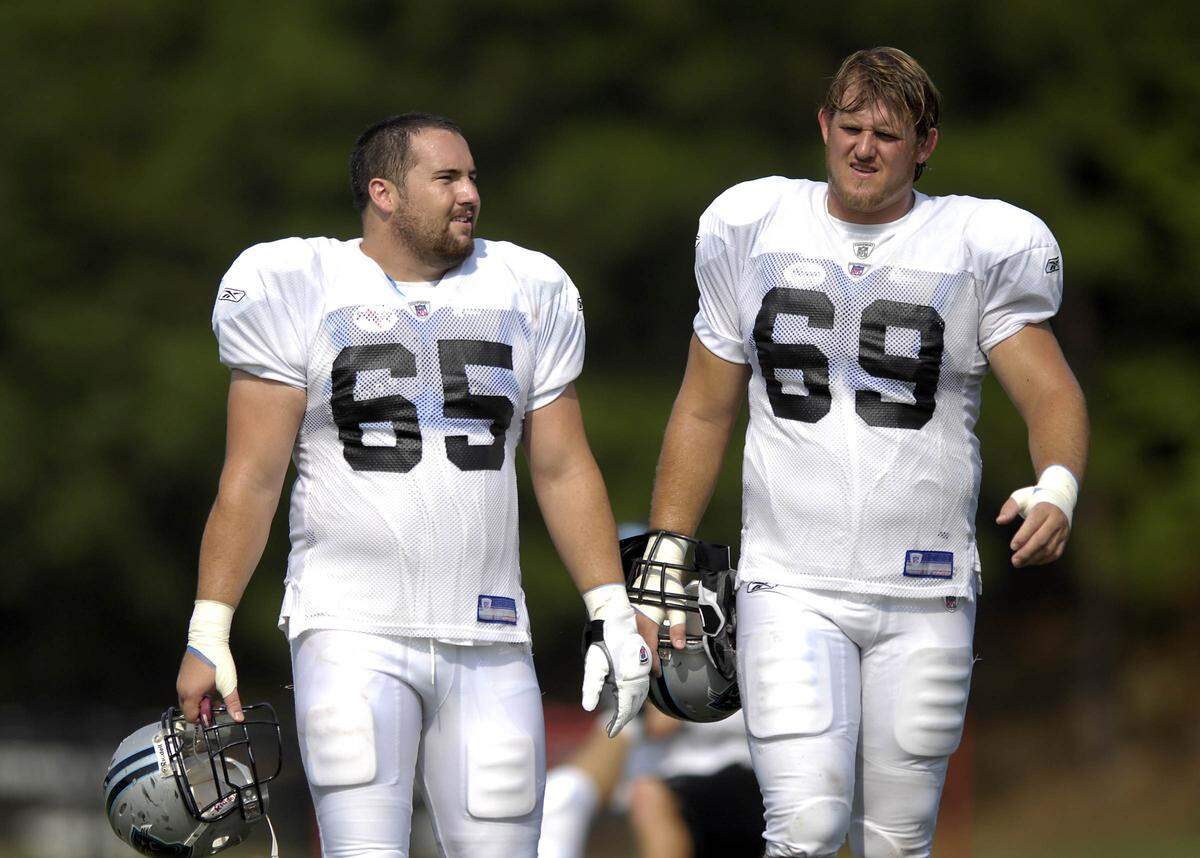 Panthers center Ryan Kalil (#65) and tackle Jordan Gross (#69) walk off the practice field on Tuesday afternoon during Panthers Training Camp at Wofford College in Spartanburg, SC. DAVID T. FOSTER III-dtfoster@charlotteobserver.com