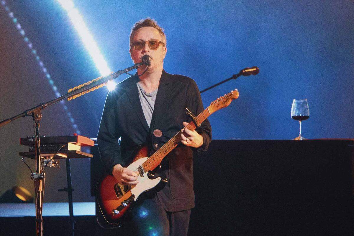 Paul Doucette and his trusty glass of red wine at PNC Music Pavilion on Tuesday night.