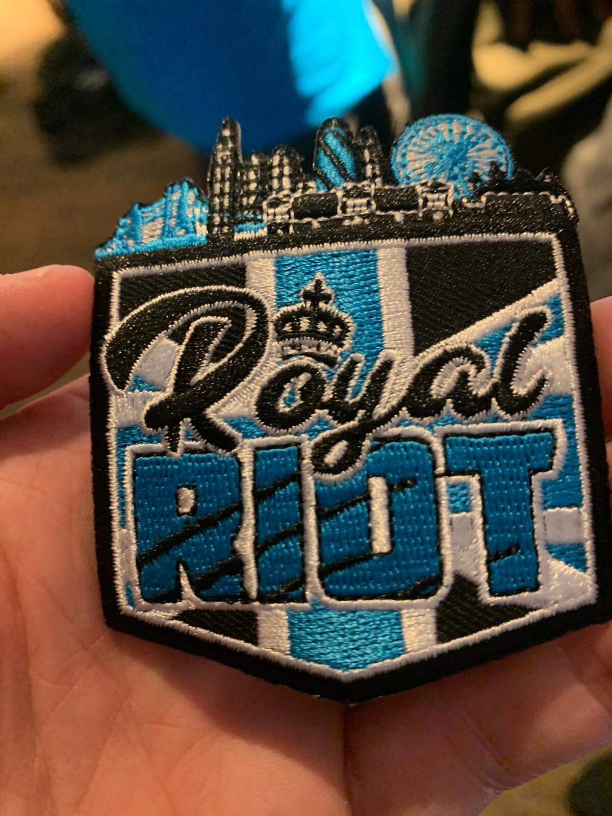 British Carolina Panthers fans who pay to join the Royal Riot receive a patch and a shirt as part of their membership.