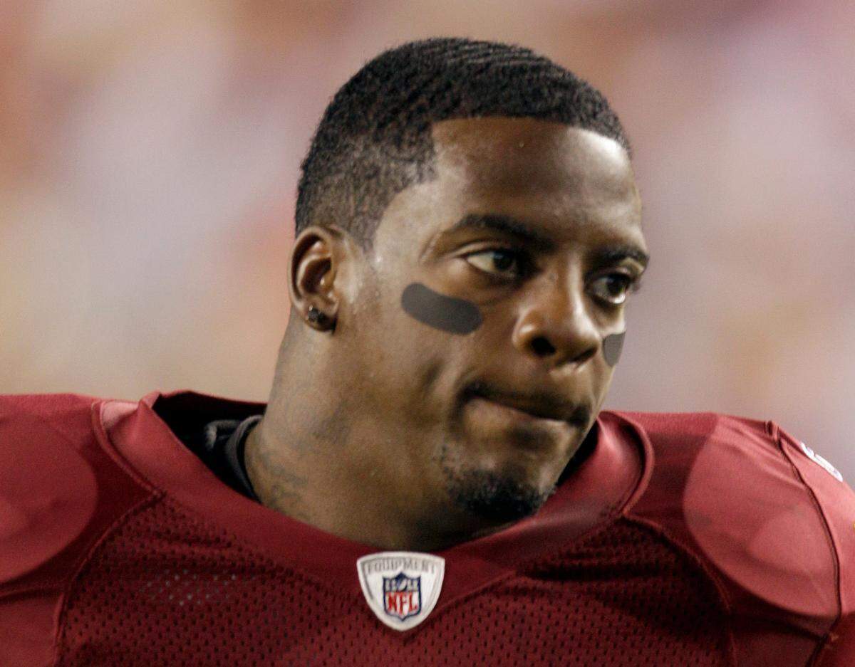 Former NFL running back Clinton Portis, shown in this 2010 photo, was sentenced to six months in prison by a federal judge in Kentucky on Thursday, Jan. 6, 2022. Portis is one of 15 former NFL players charged with bilking a league medical reimbursement plan.