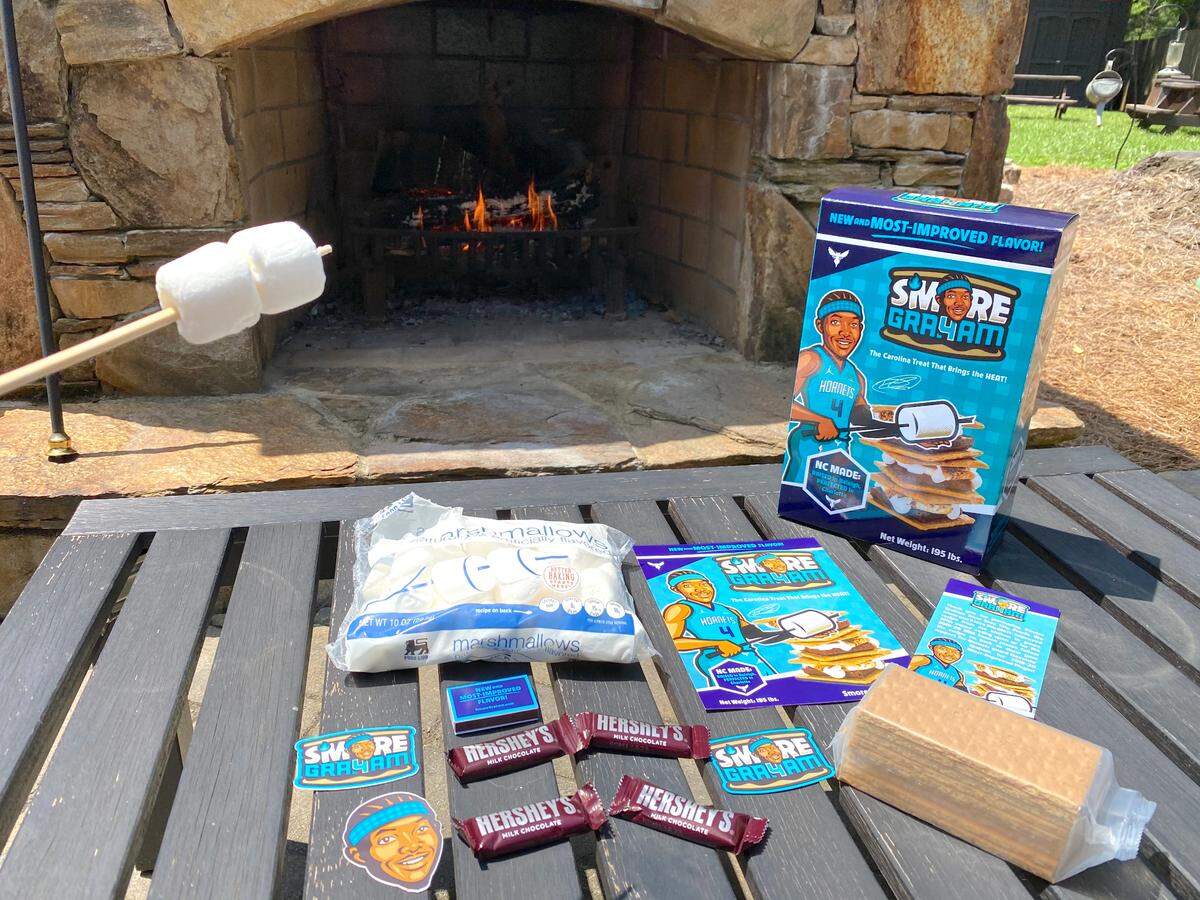 The S’more Graham comes with marshmallows, chocolate, graham crackers, Devonte’ Graham stickers and a magnet, and a mini-poster. You can make them in your fireplace or on your stovetop (directions included).
