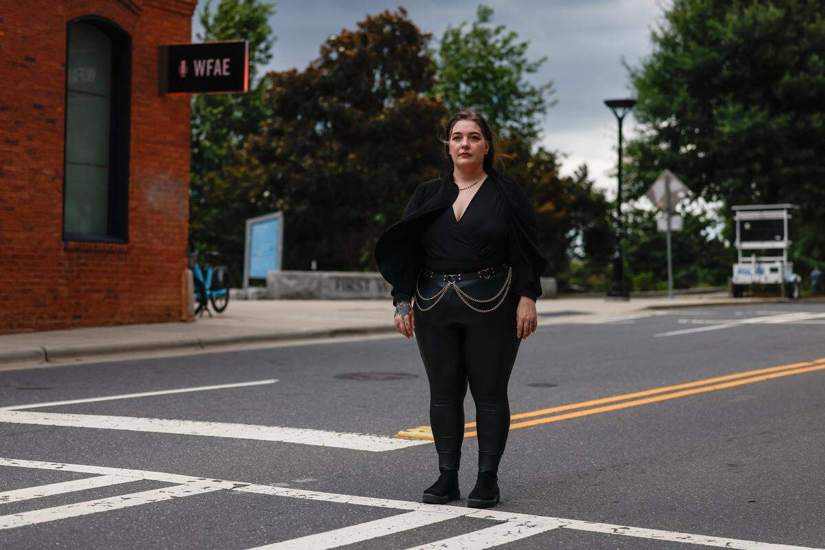 No Kings protestor, Lindsey Key, stands where a CMPD officer hit her with a bike in uptown. Key called 911 to report the incident and has filed a report. 