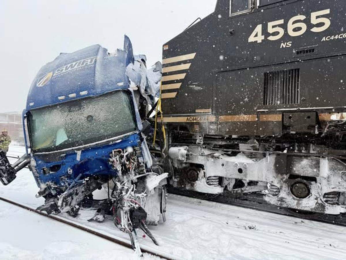 The driver of a semi-tractor trailer escaped injury when a train hit the rig at Poplar Street and Airline Avenue during a snow storm on Saturday, Jan. 31, 2026.