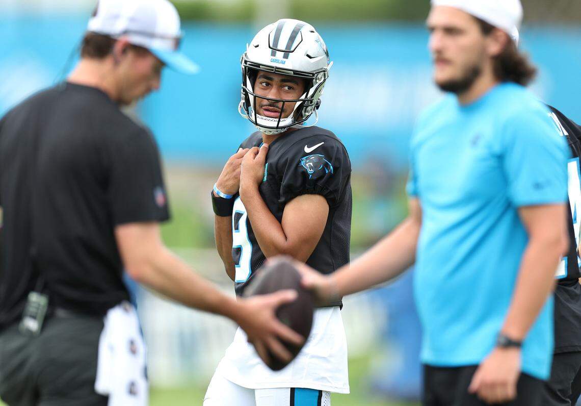 Carolina Panthers quarterback Bryce Young, center, waits to begin a series of drills during practice on Tuesday, August 6, 2024.