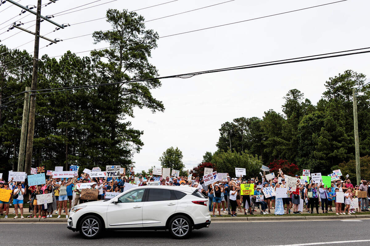 Hundreds gather to protest the sale of the Morrison Family YMCA campus in Ballantyne to Moments of Hope Church on Sunday, July 12, 2026.