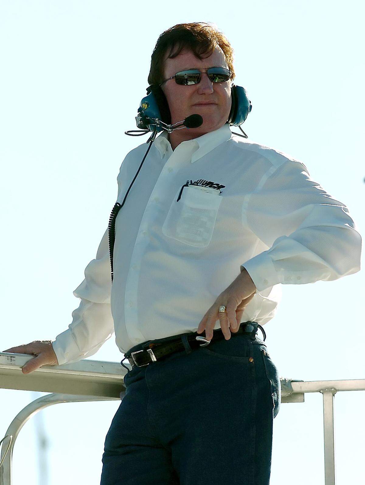 10/12/06 NEXTEL Cup team owner Richard Childress watches NEXTEL Cup practice from atop his transporter Thursday at Lowe’s Motor Speedway. JEFF SINER - jsiner@charlotteobserver.com