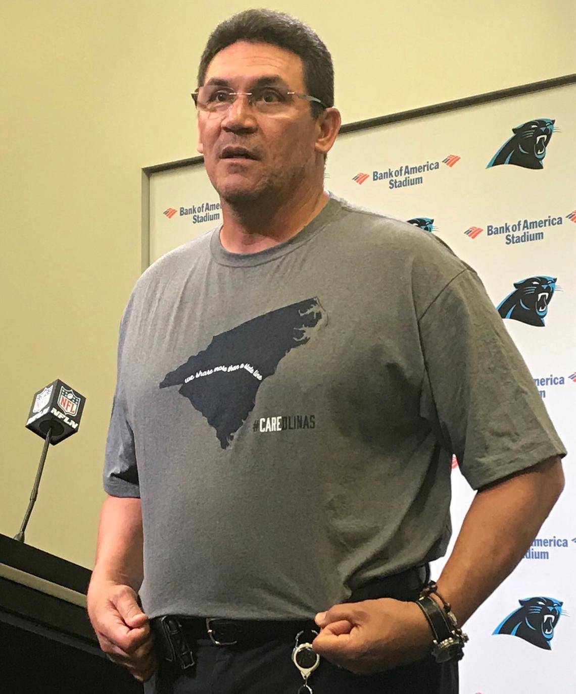 Carolina Panthers coach Ron Rivera wears a T-shirt benefiting Hurricane Florence relief at a Monday news conference in Charlotte.