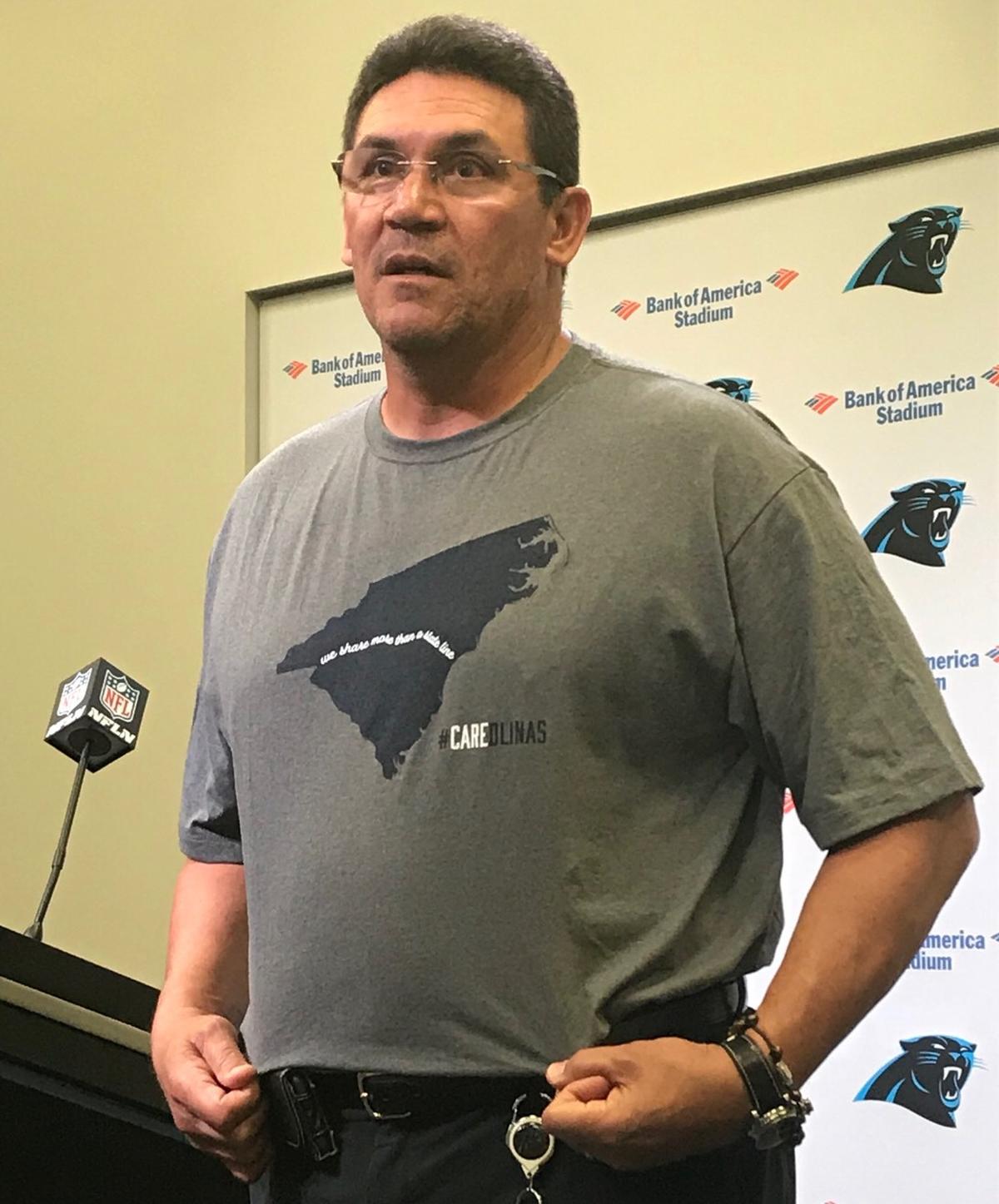 Carolina Panthers coach Ron Rivera wears a T-shirt benefiting Hurricane Florence relief at a Monday news conference in Charlotte.