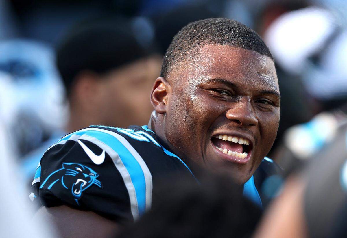 Carolina Panthers defensive end Derrick Brown smiles at his teammates following a series against the Tampa Bay Buccaneers during second-quarter action at Bank of America Stadium in Charlotte, NC on Jan. 7, 2024.
