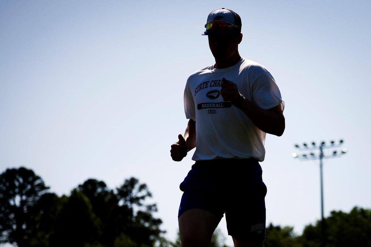 Charlotte Christian’s Judd Utermark runs drills with teammates during practice at Charlotte Christian School in Charlotte, N.C., Wednesday, April 27, 2022. This season Utermark broke a 22-year old school record for home runs and as of Monday, April 25 he leads the nation win home runs.
