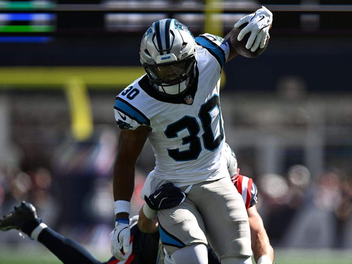 Carolina Panthers running back Chuba Hubbard (30) runs against the New England Patriots during Sunday’s first half at Gillette Stadium.