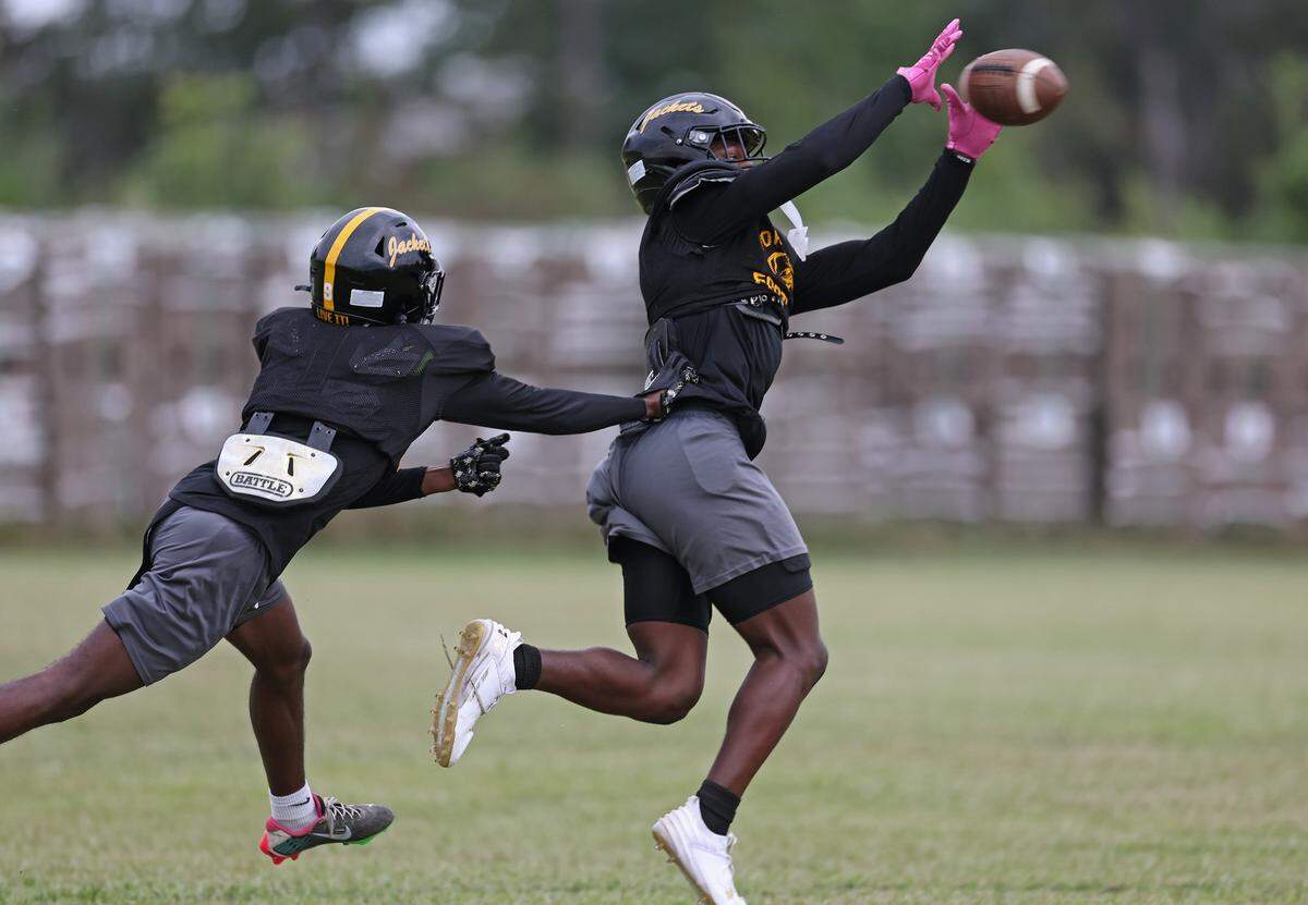 Forest Hills High School wide receiver Jerel Bolder, right, catches a pass across the middle during practice on Tuesday, September 24, 2024. Bolder has committed to play at North Carolina State.