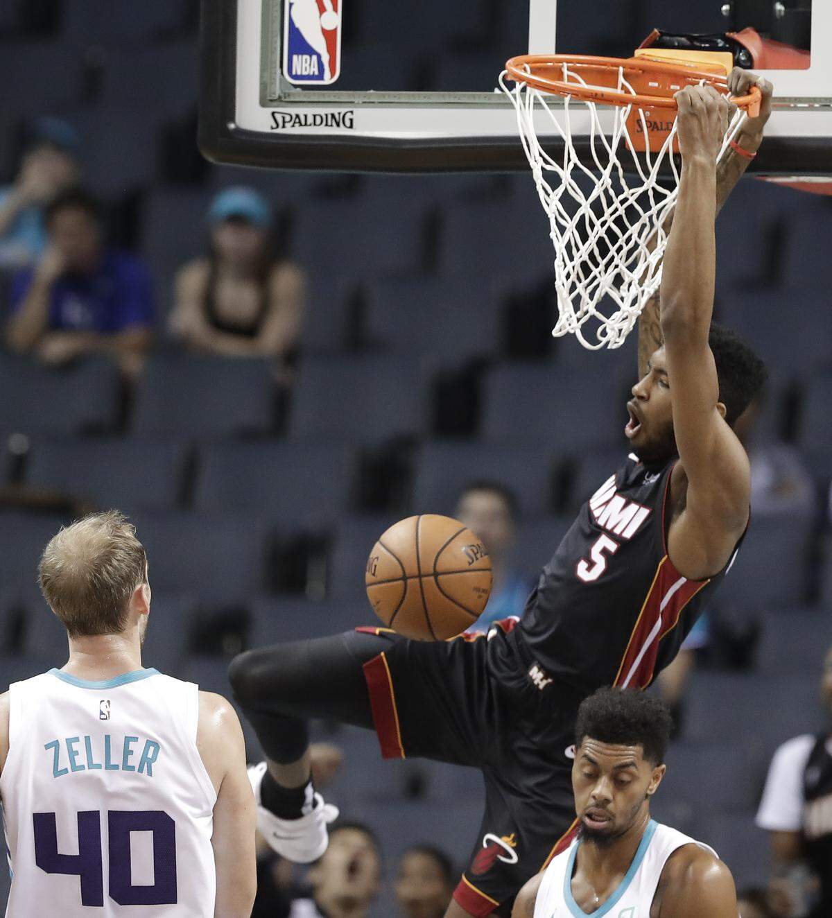 The Miami Heat and Derrick Jones Jr. (5) attacked the relatively unprotected rim effectively against the Charlotte Hornets and Cody Zeller (40) in the first half Tuesday, but Charlotte rallied after halftime.