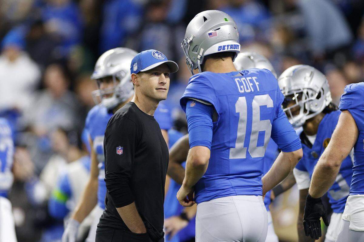Offensive coordinator Ben Johnson and Jared Goff (16) of the Detroit Lions speak on the field prior to a game against the Green Bay Packers at Ford Field on Nov. 23, 2023, in Detroit. (Mike Mulholland/Getty Images/TNS)