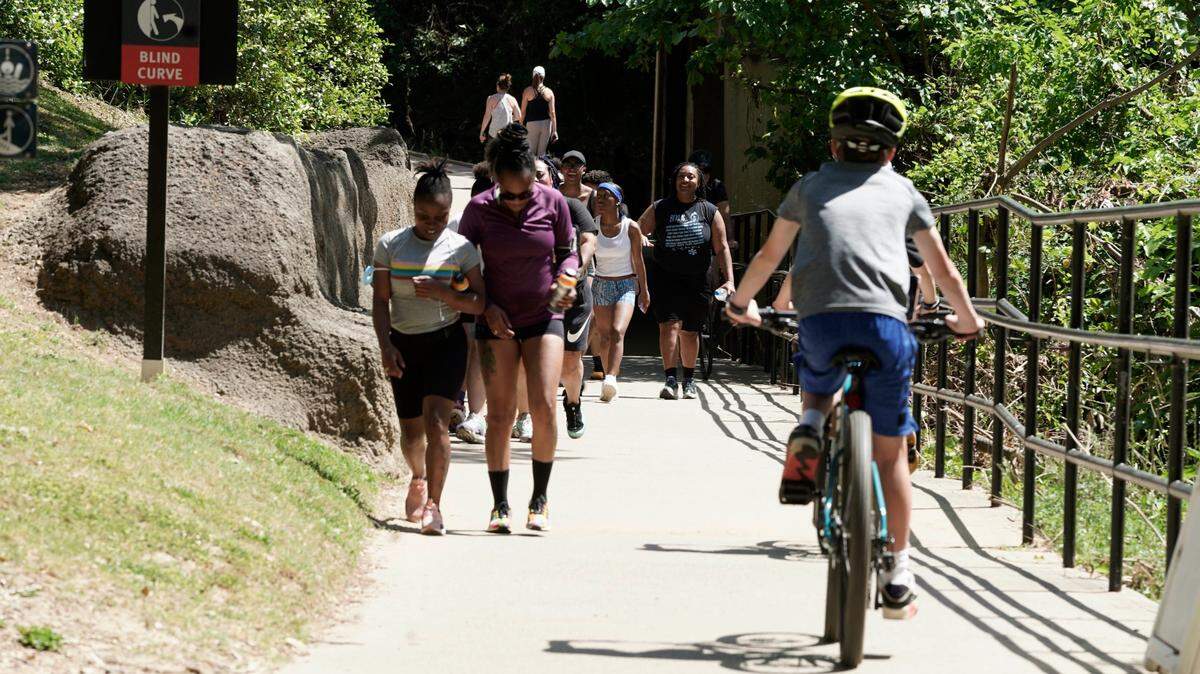 Cyclists and pedestrians flow along the Little Sugar Creek Greenway on Saturday, May 16, 2020.