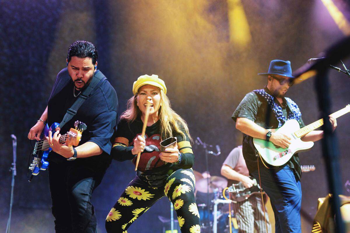 From right, Men at Work members Yosmel Montejo, Cecilia Noël and San Miguel Perez perform at PNC Music Pavilion on Thursday night.