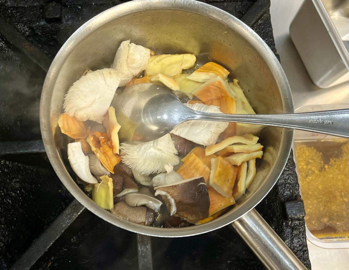 The medley of mushrooms cooks down thanks to rendered bacon fat from Belly Brothers Farms.