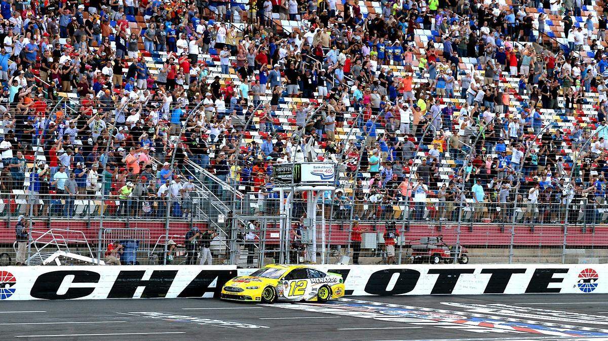 NASCAR driver Ryan Blaney crosses the finish line at Charlotte Motor Speedway in Concord, NC to win the Bank of America ROVAL 400. Blaney won the race when leader Martin Truex Jr was involved in an accident with then second place driver Jimmie Johnson in the final turn of the ROVALL. The wreck allowed Blaney to pass the two out of the final turn.