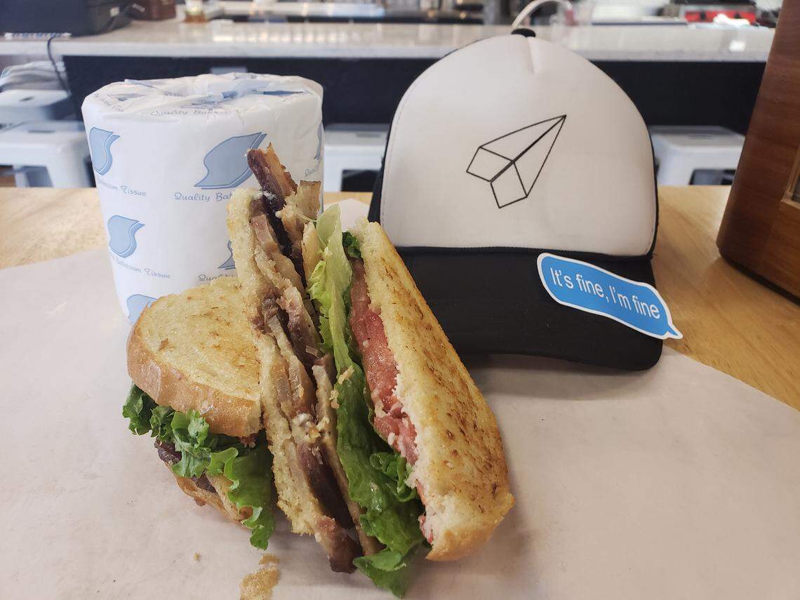 Free toilet paper with purchase at Paper Plane Deli & Market.