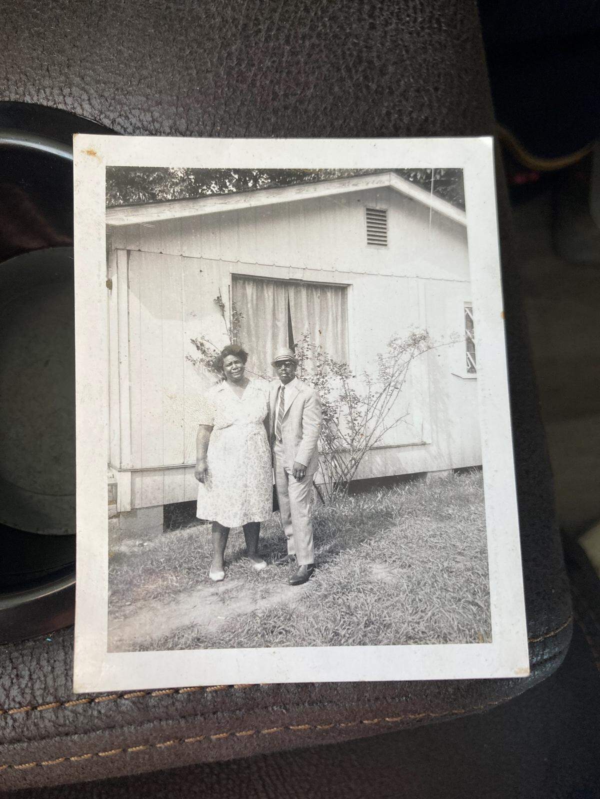 Alfred McClure Jr., who built the home himself, and his aunt, Maggie Crosby, outside their family home.