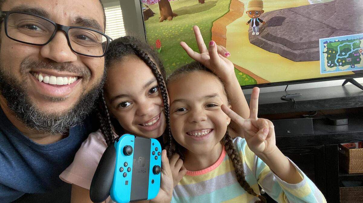 Brent, Analeigh and Alayna Peters play Animal Crossing: New Horizons on the Nintendo Switch.