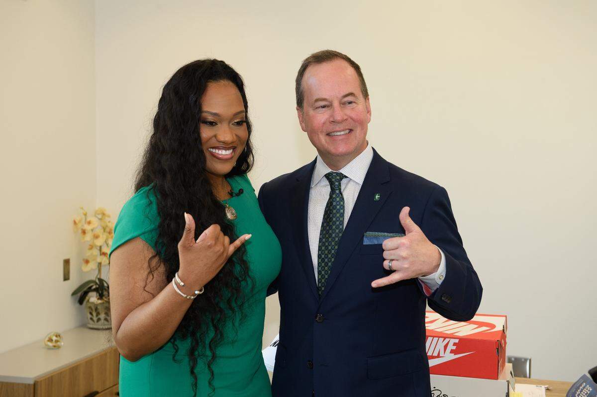 Charlotte 49ers women’s basketball coach Tomekia Reed with athletic director Mike Hill.